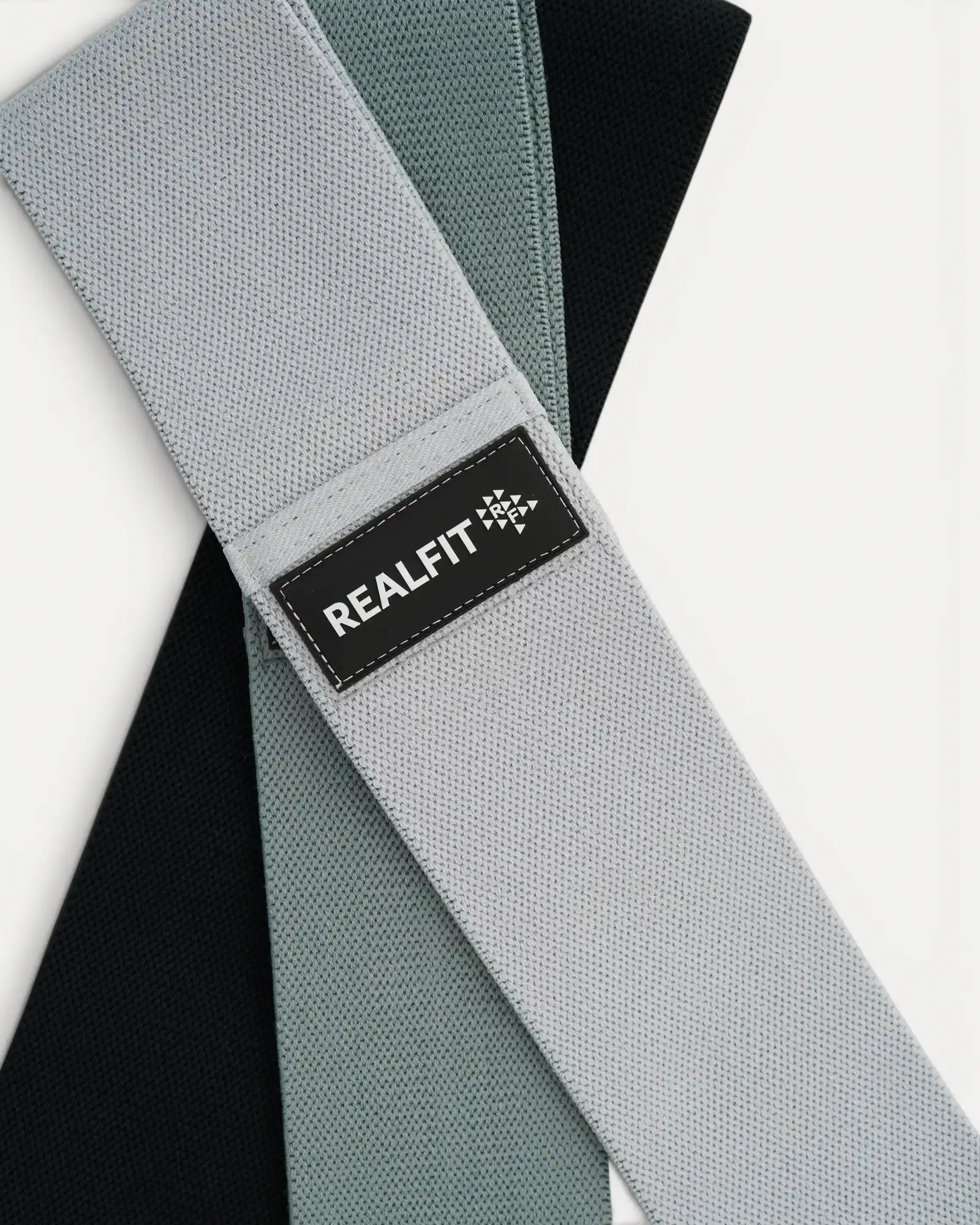 Realfit Performance Resistance Bands 3-Pack showing woven fabric texture and branded logo detail
