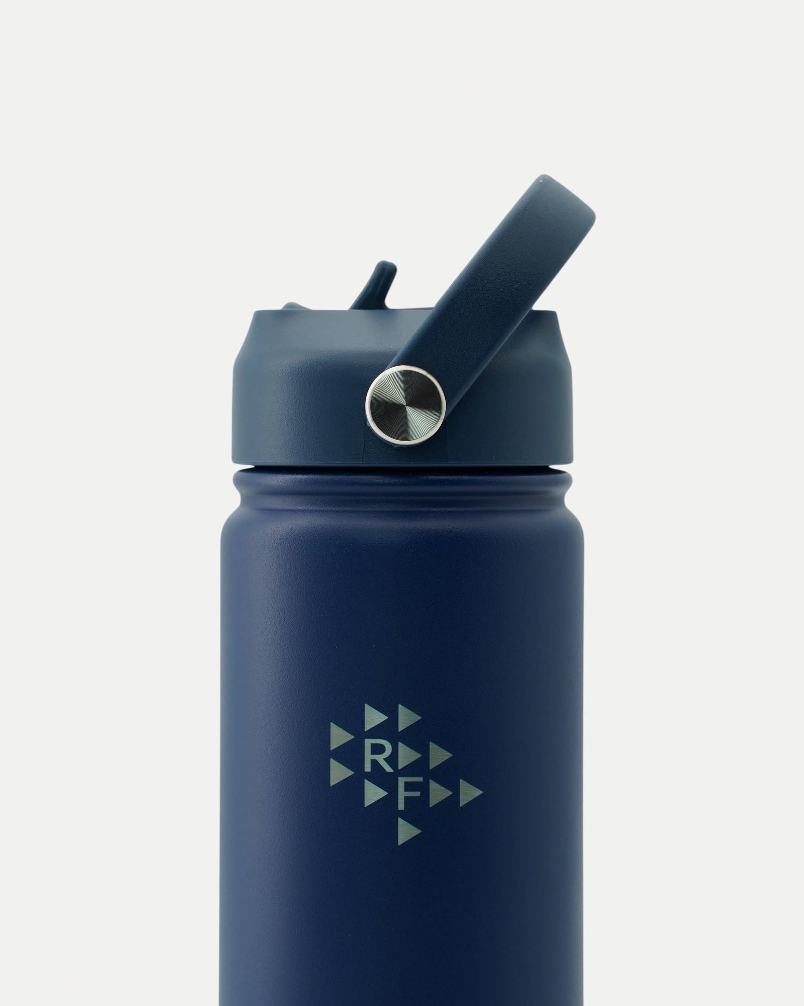 Close-up front view of Realfit Midnight Navy stainless steel water bottle with Realfit logo