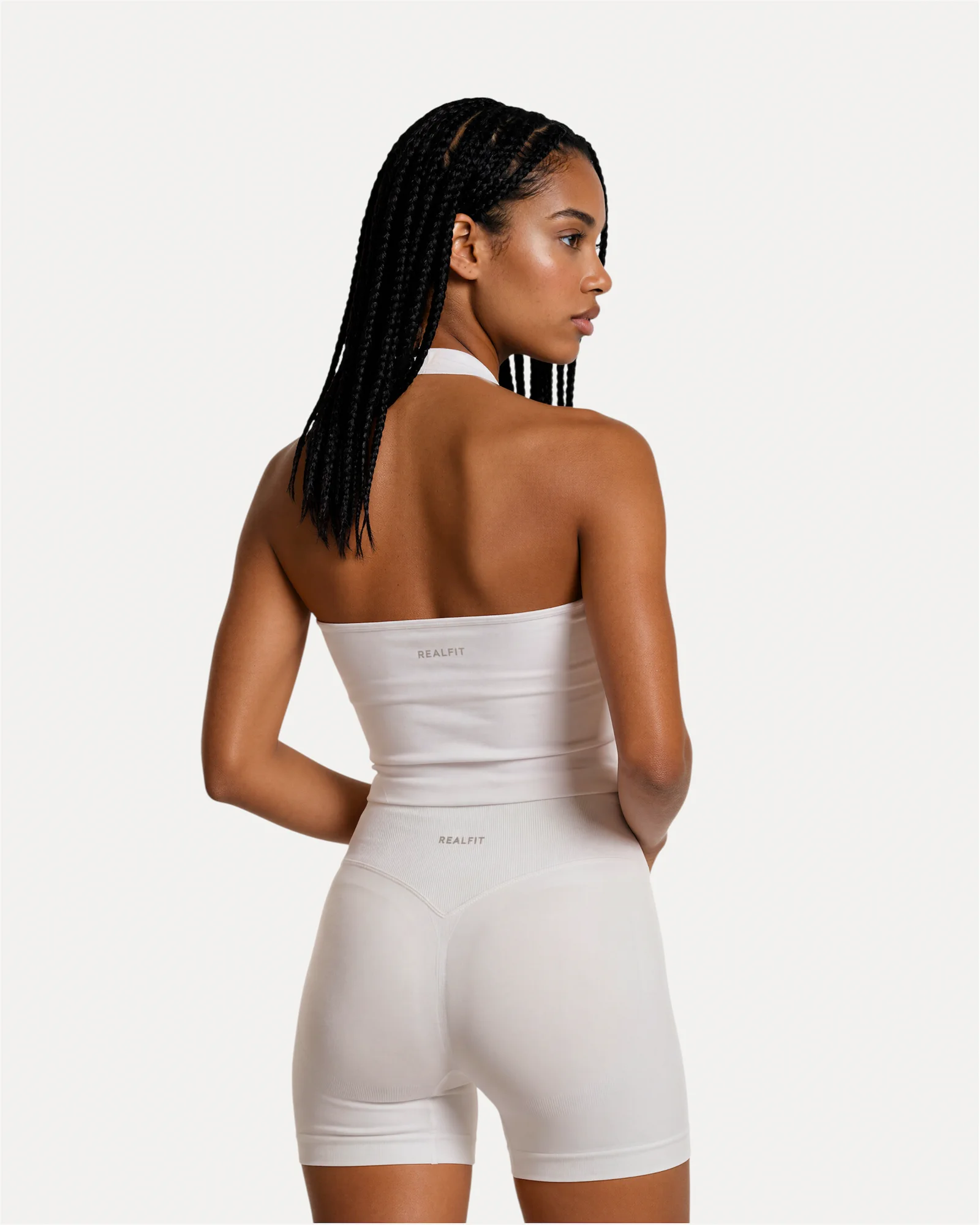 Back view of optic white Realfit Core Halter Tank top for women