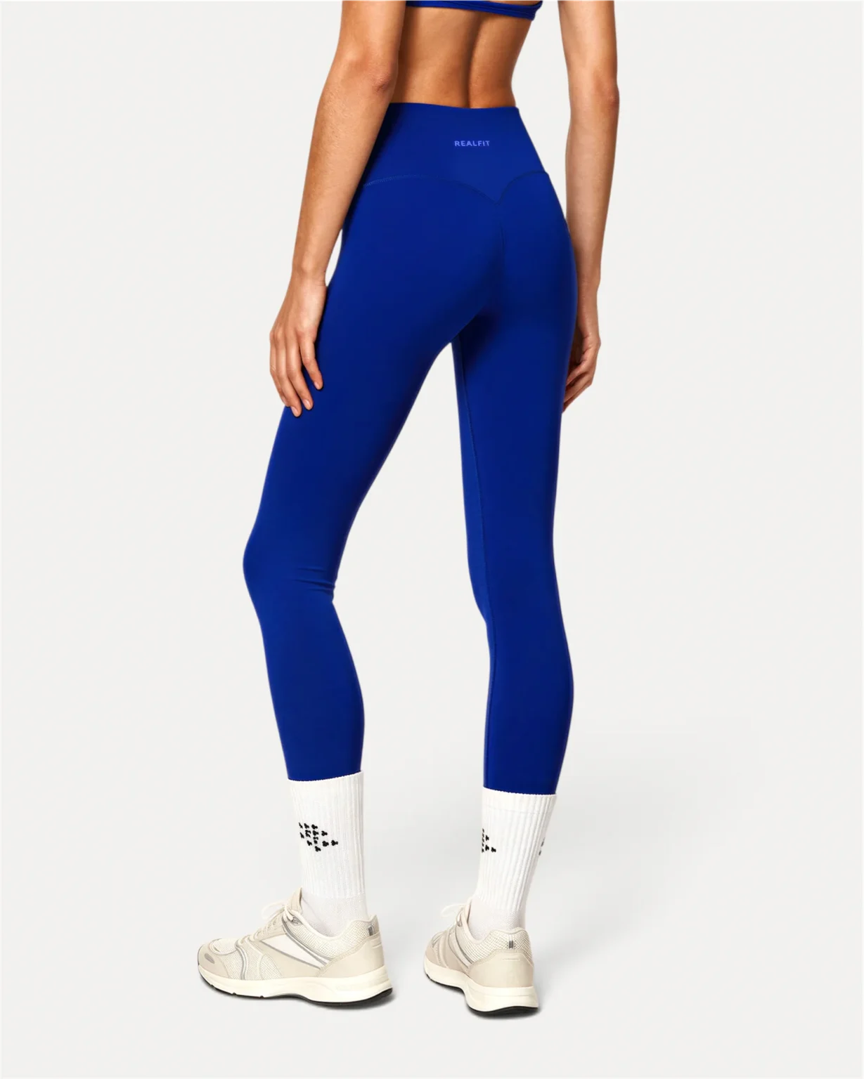 back view of deep blue Realfit core leggings for women