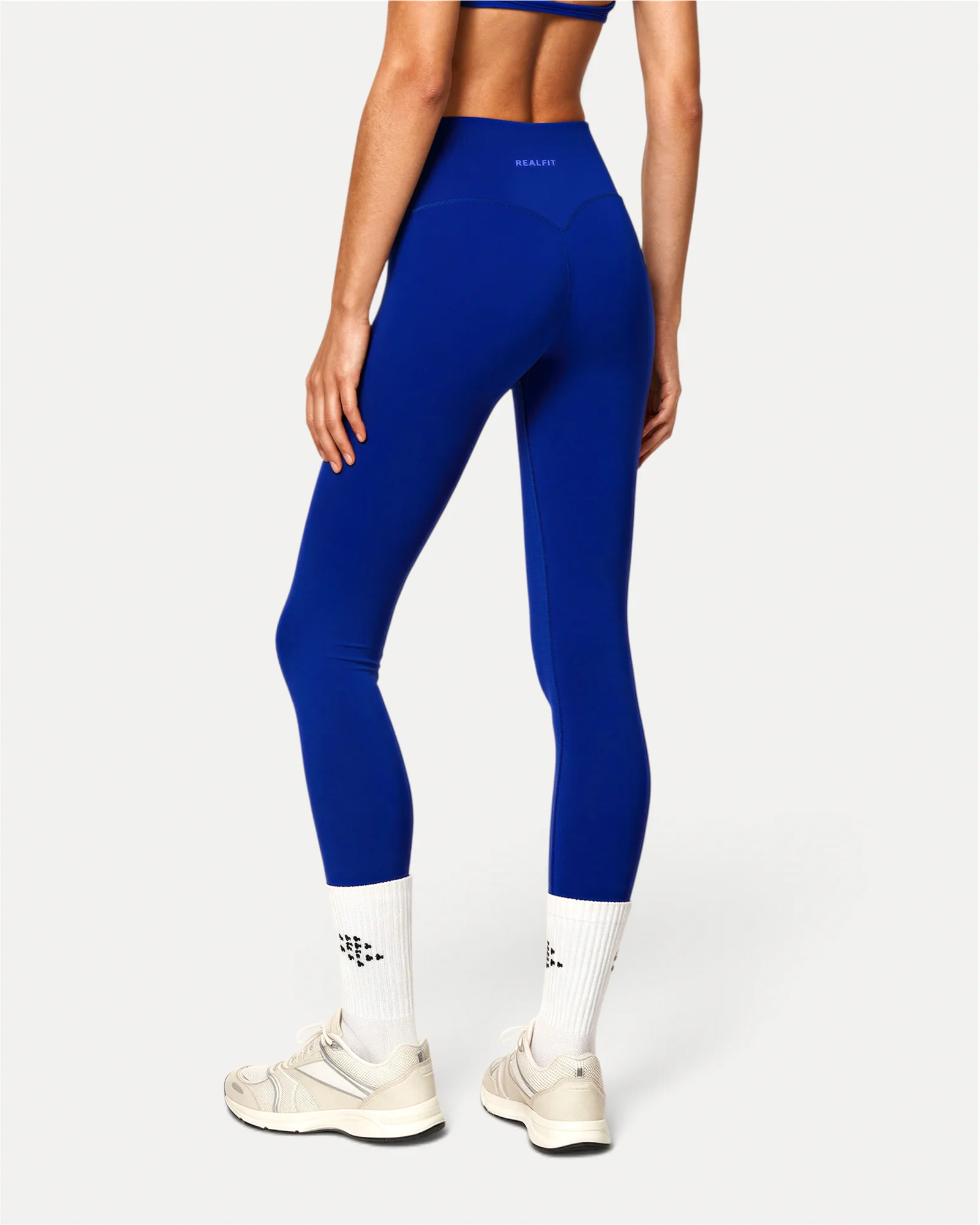 back view of deep blue Realfit core leggings for women