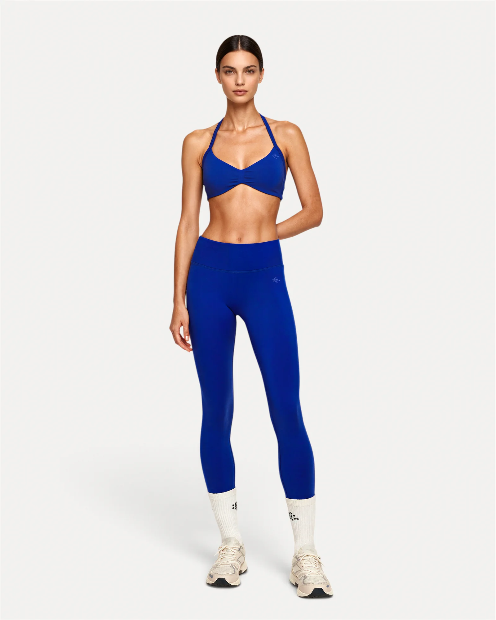 Front lifestyle view of deep blue Realfit core leggings for women