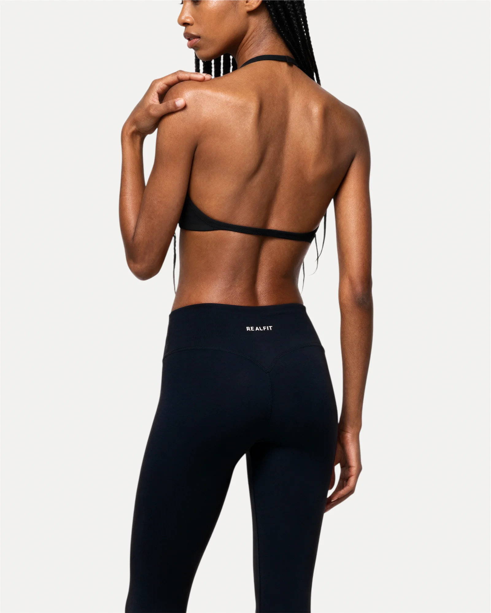 Back view of midnight black Realfit core leggings for women