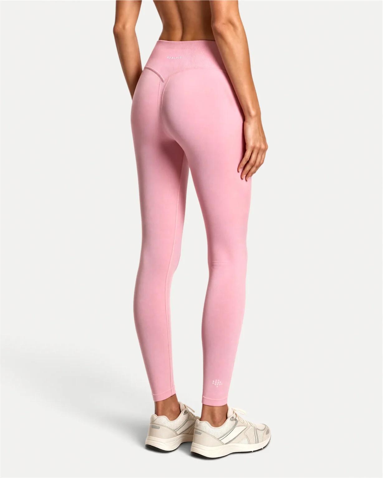 Back view of soft pink Realfit core leggings for women