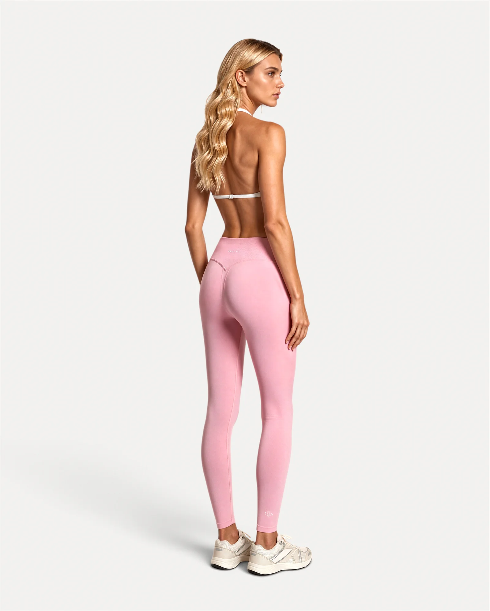 Back view of soft pink Realfit core leggings for women