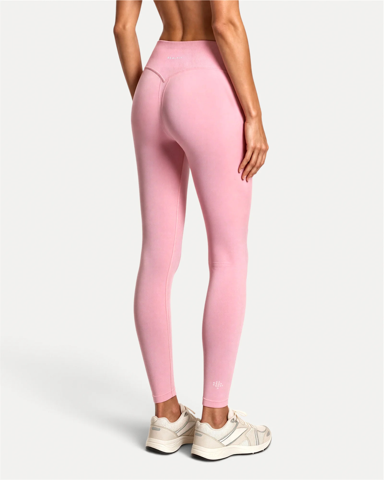 Back view of soft pink Realfit core leggings for women
