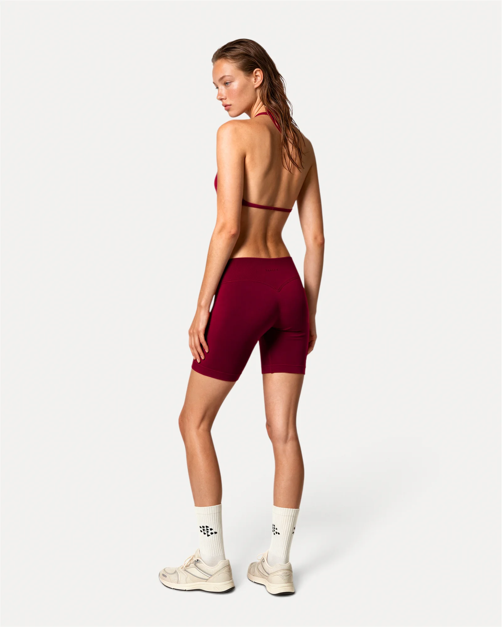 Back lifestyle view of crimson Realfit ruched bra for women