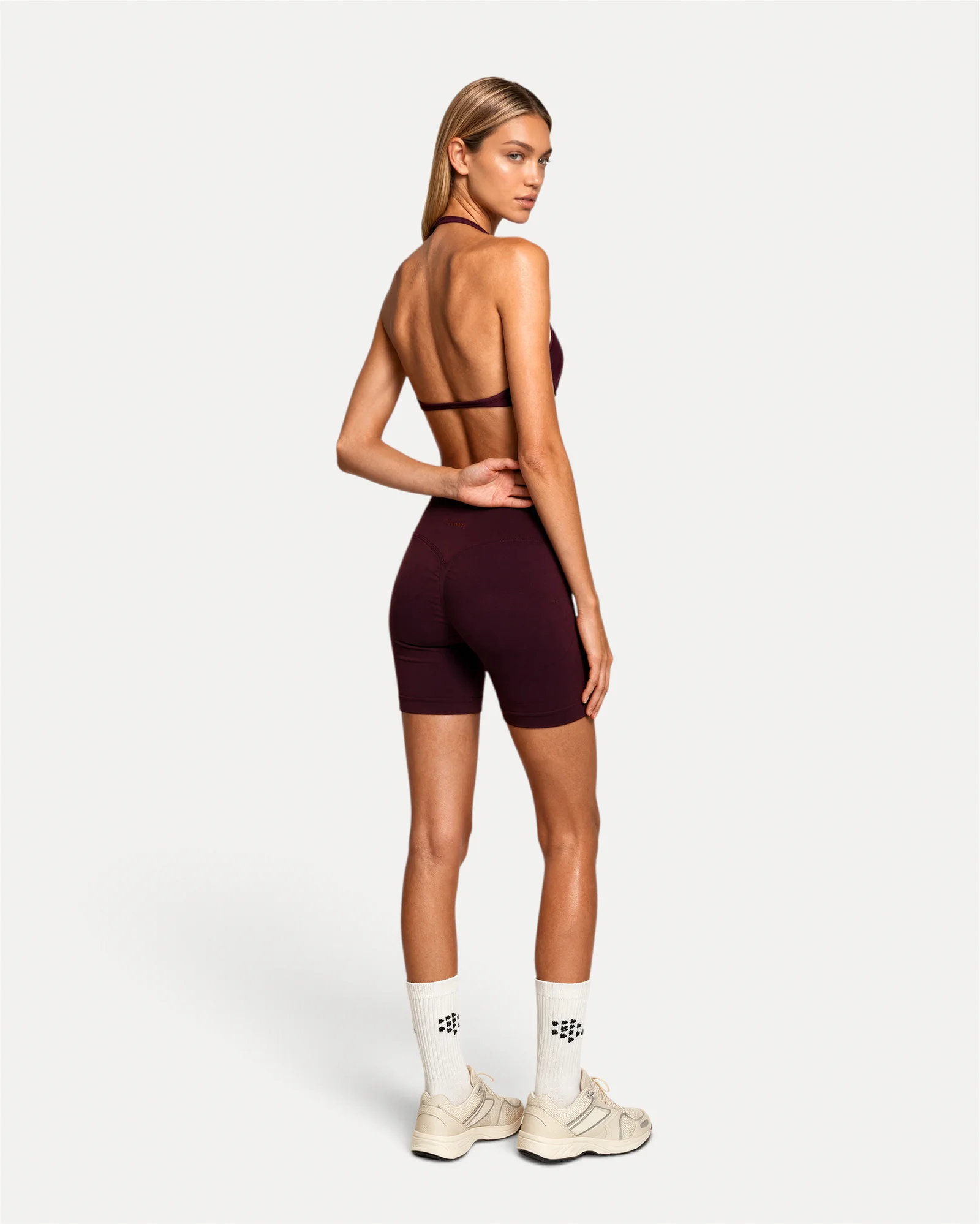 Back angled lifestyle view of mulberry Realfit ruched bra for women