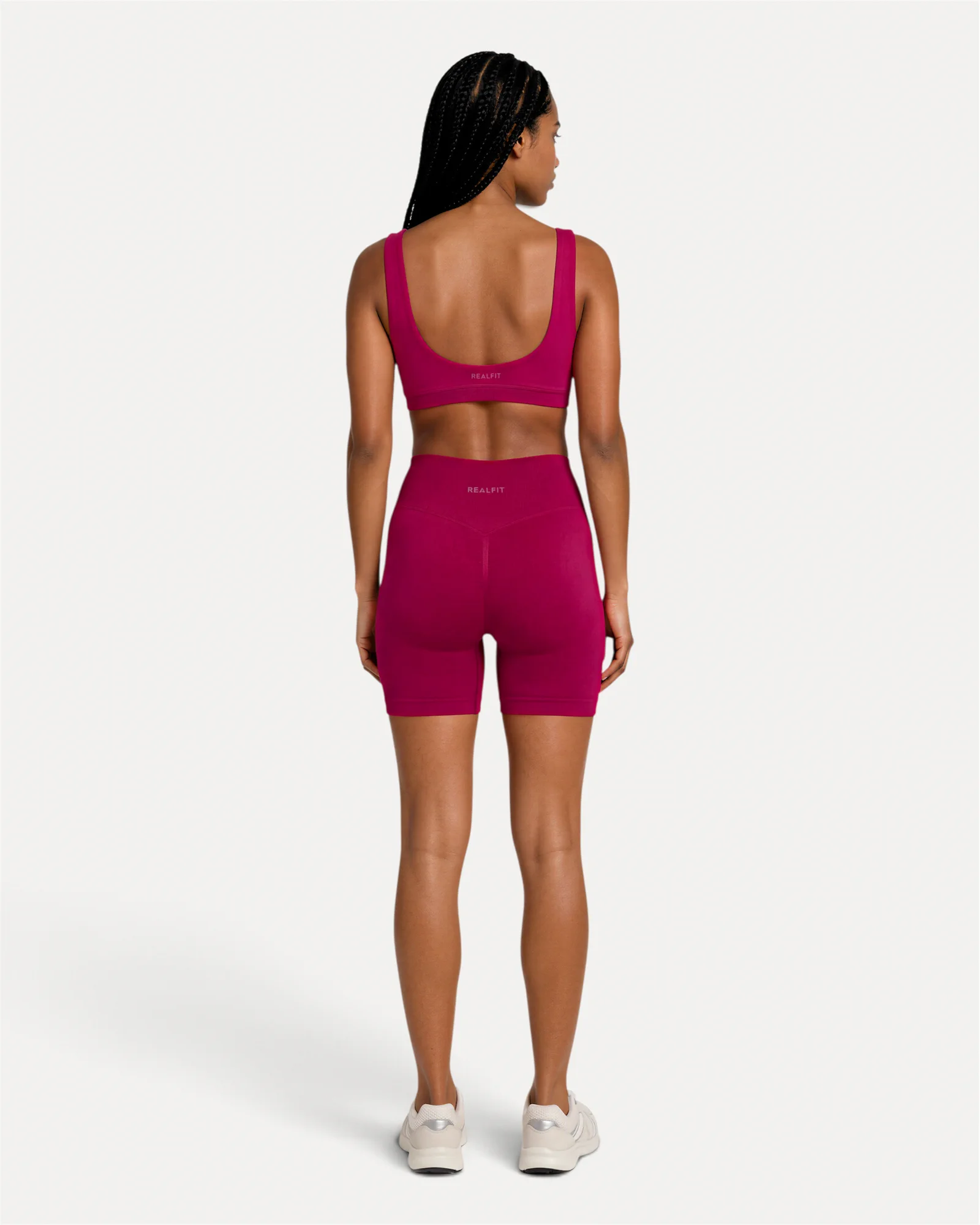 Back lifestyle view of crimson Realfit scoop bra for women