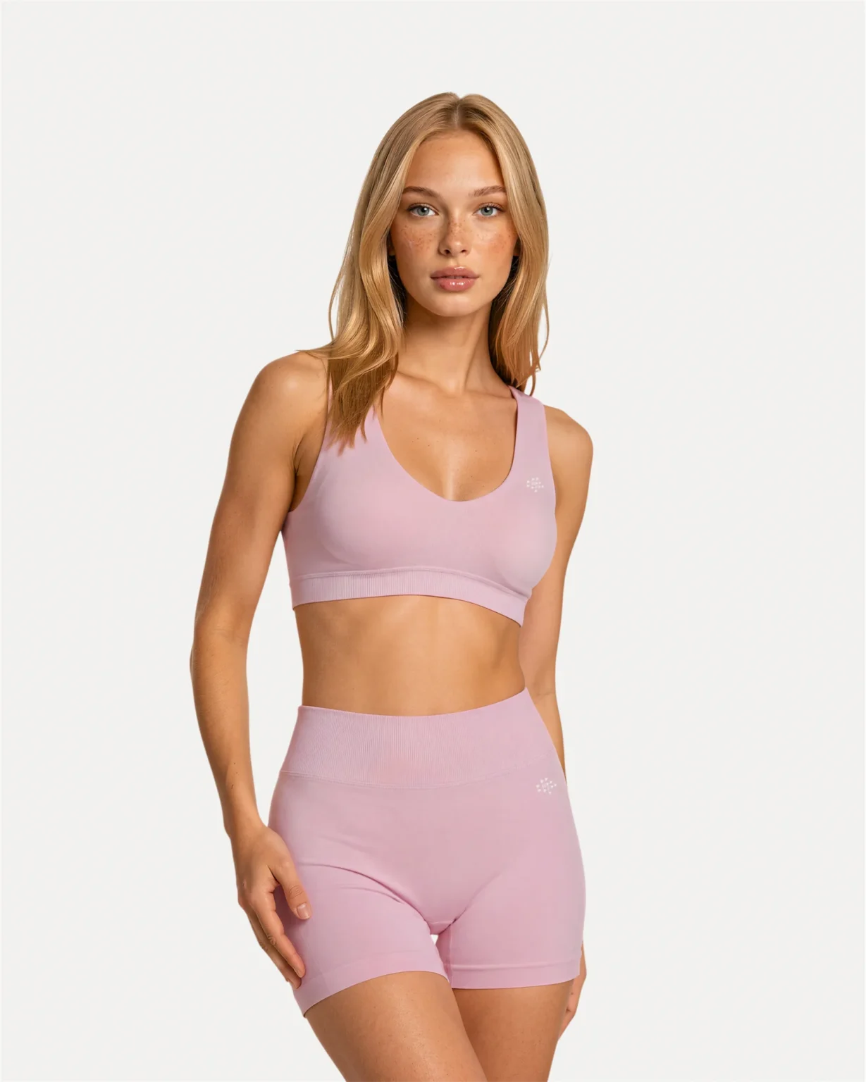 Front view of soft pink Realfit core scoop sports bra for women