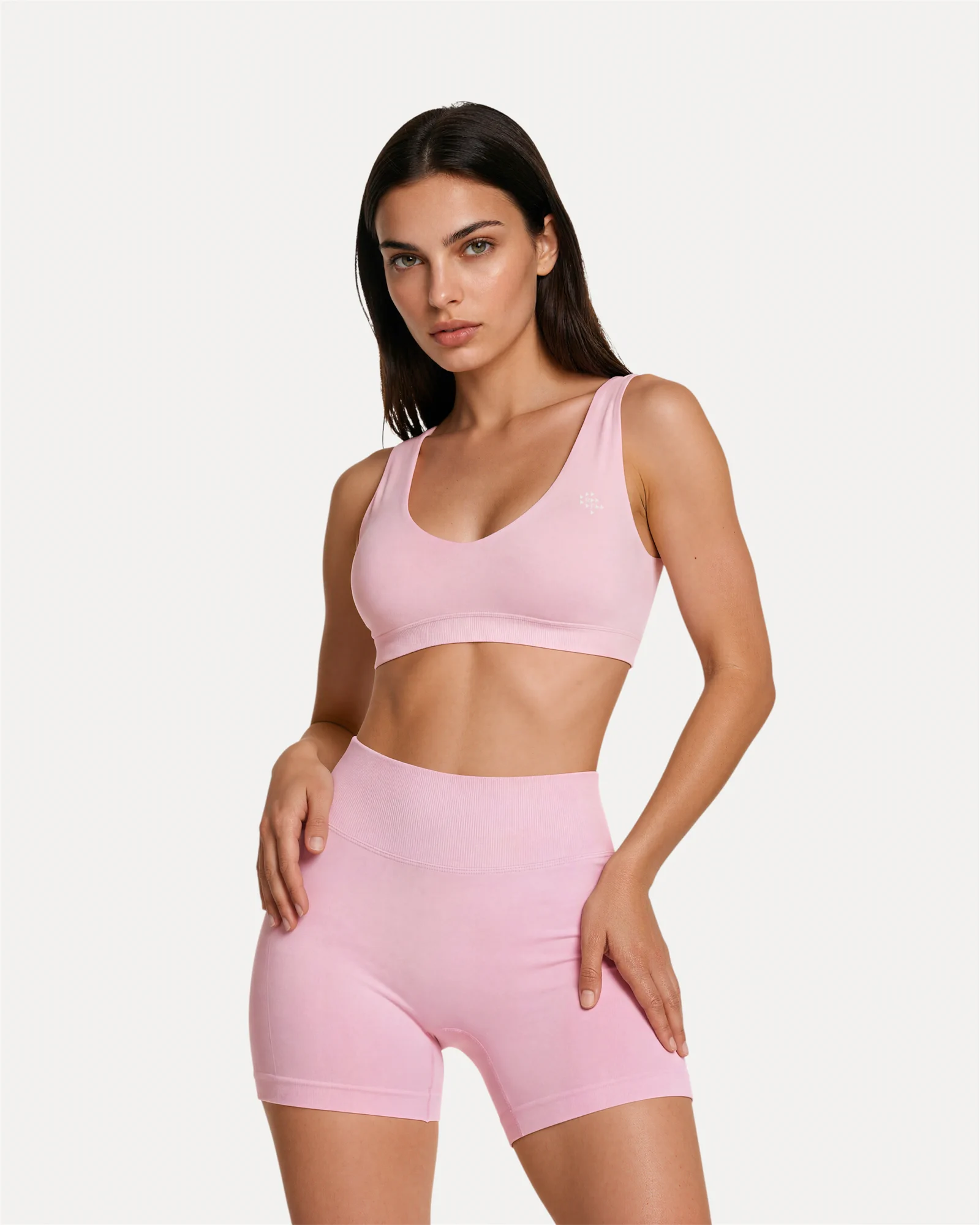 Front view of soft pink Realfit core scoop sports bra for women