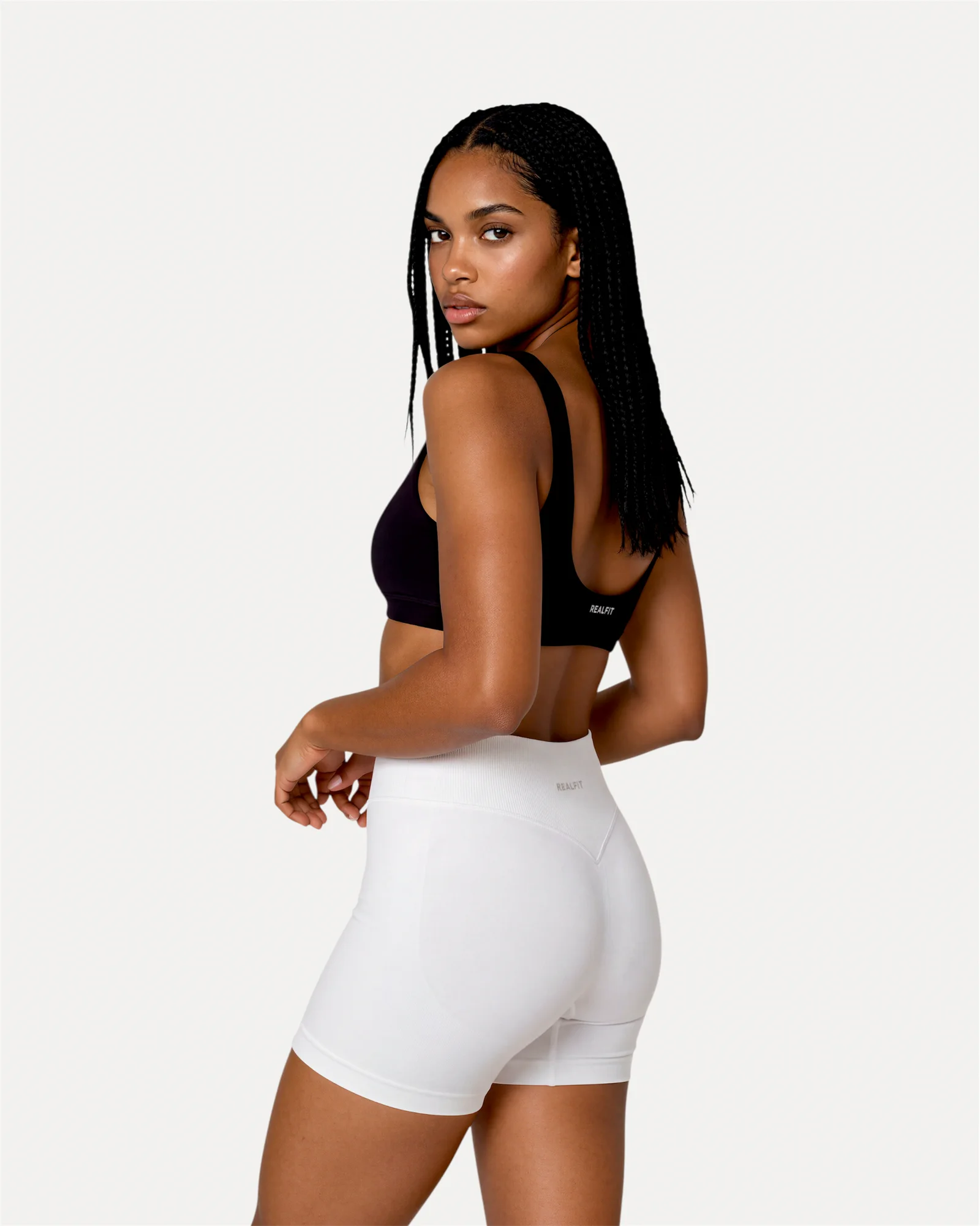 Back angled view of optic white Realfit core shorts for women
