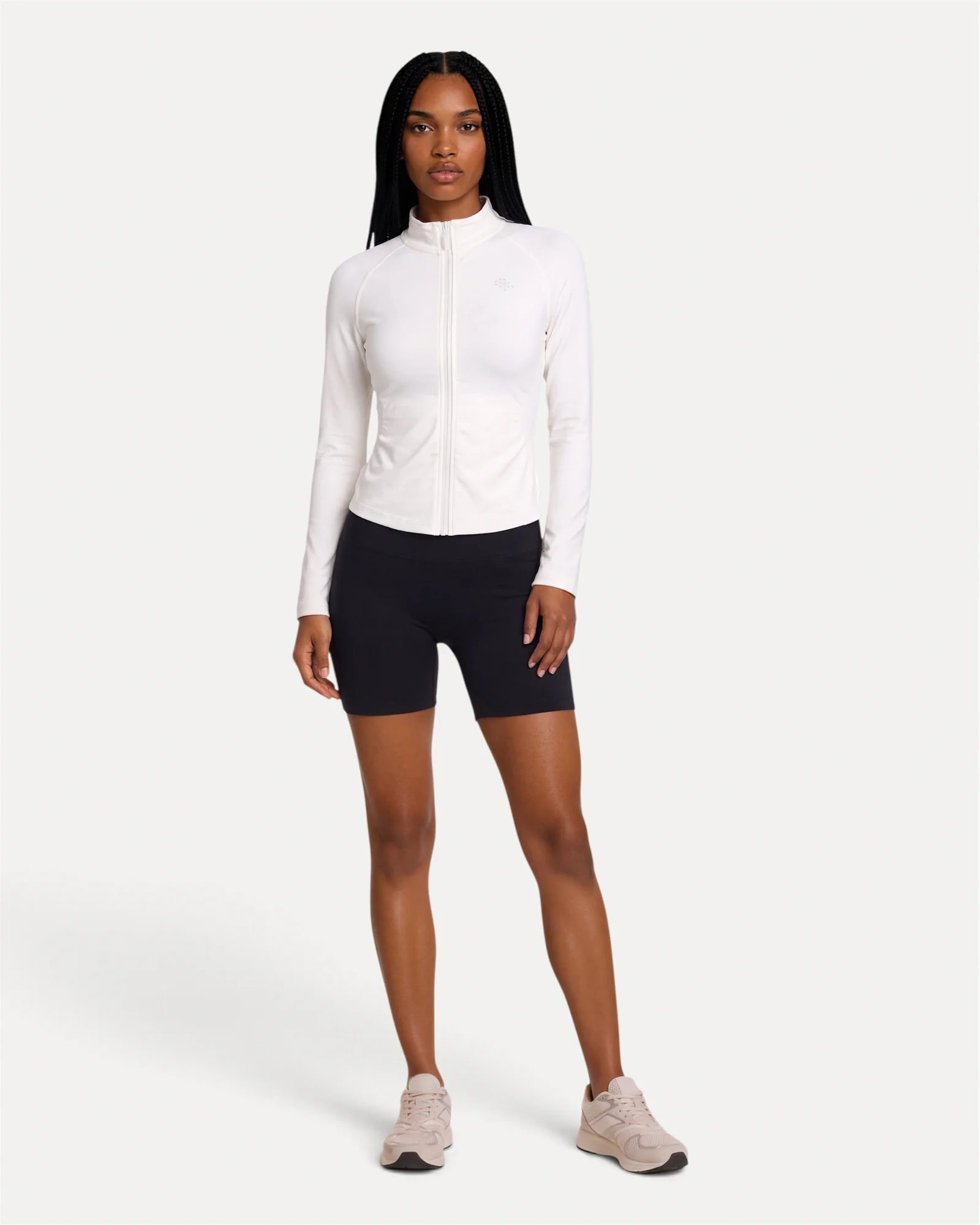 Front lifestyle view of optic white Realfit lightweight zip jacket for women