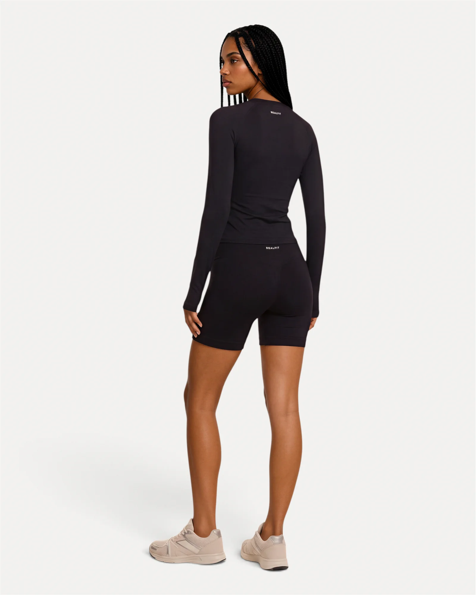 back lifestyle view of midnight black Realfit long sleeve top for women