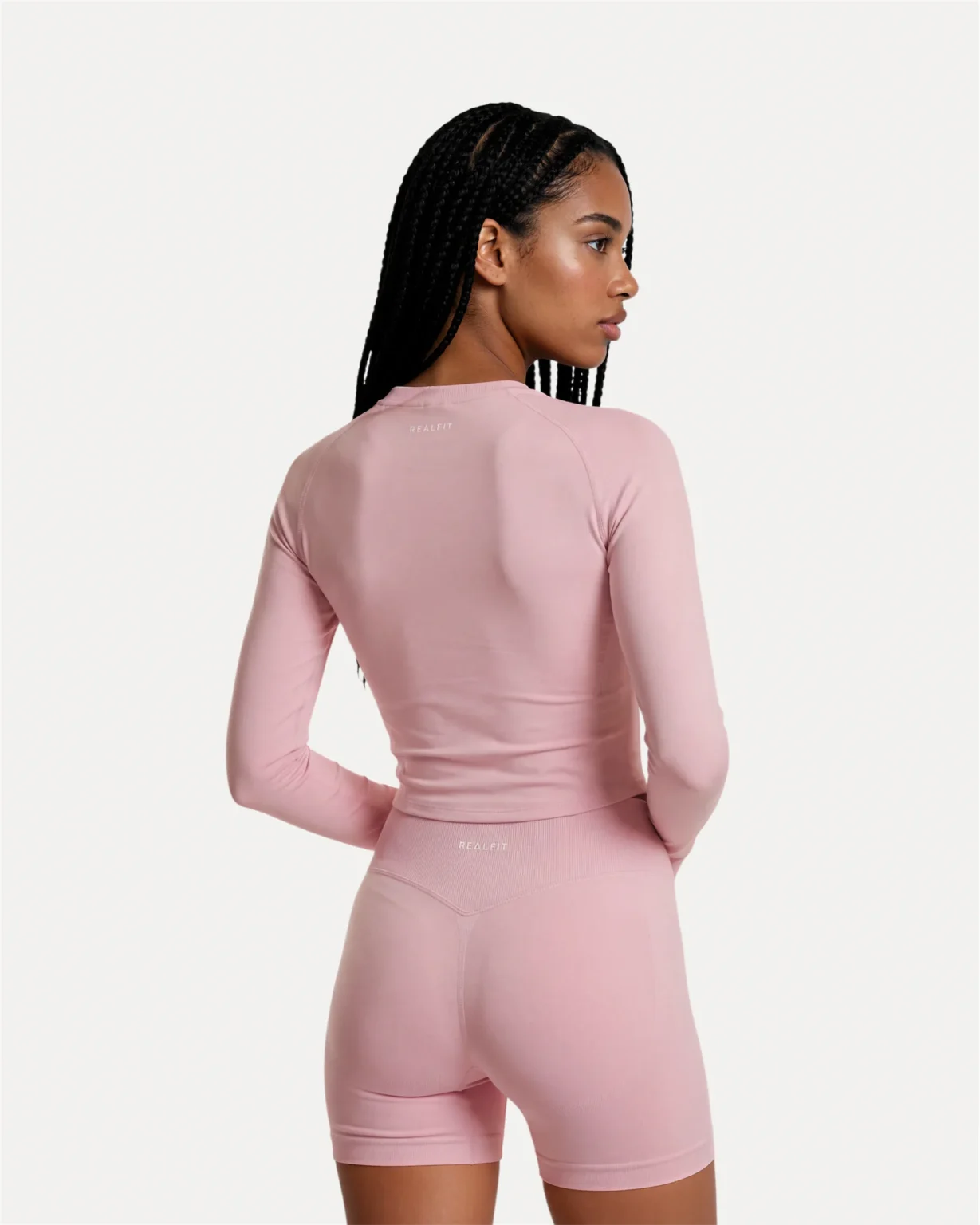 Back view of soft pink Realfit long-sleeve top for women