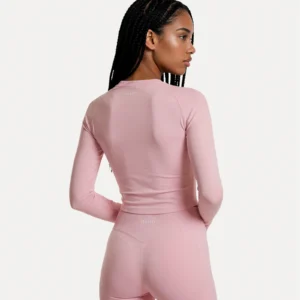 Back view of soft pink Realfit long-sleeve top for women