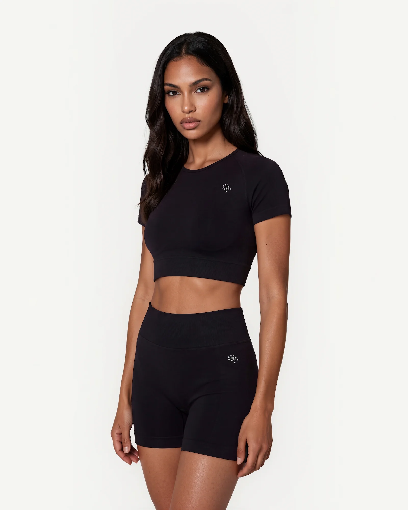 Front view of black Realfit short-sleeve crop top for women