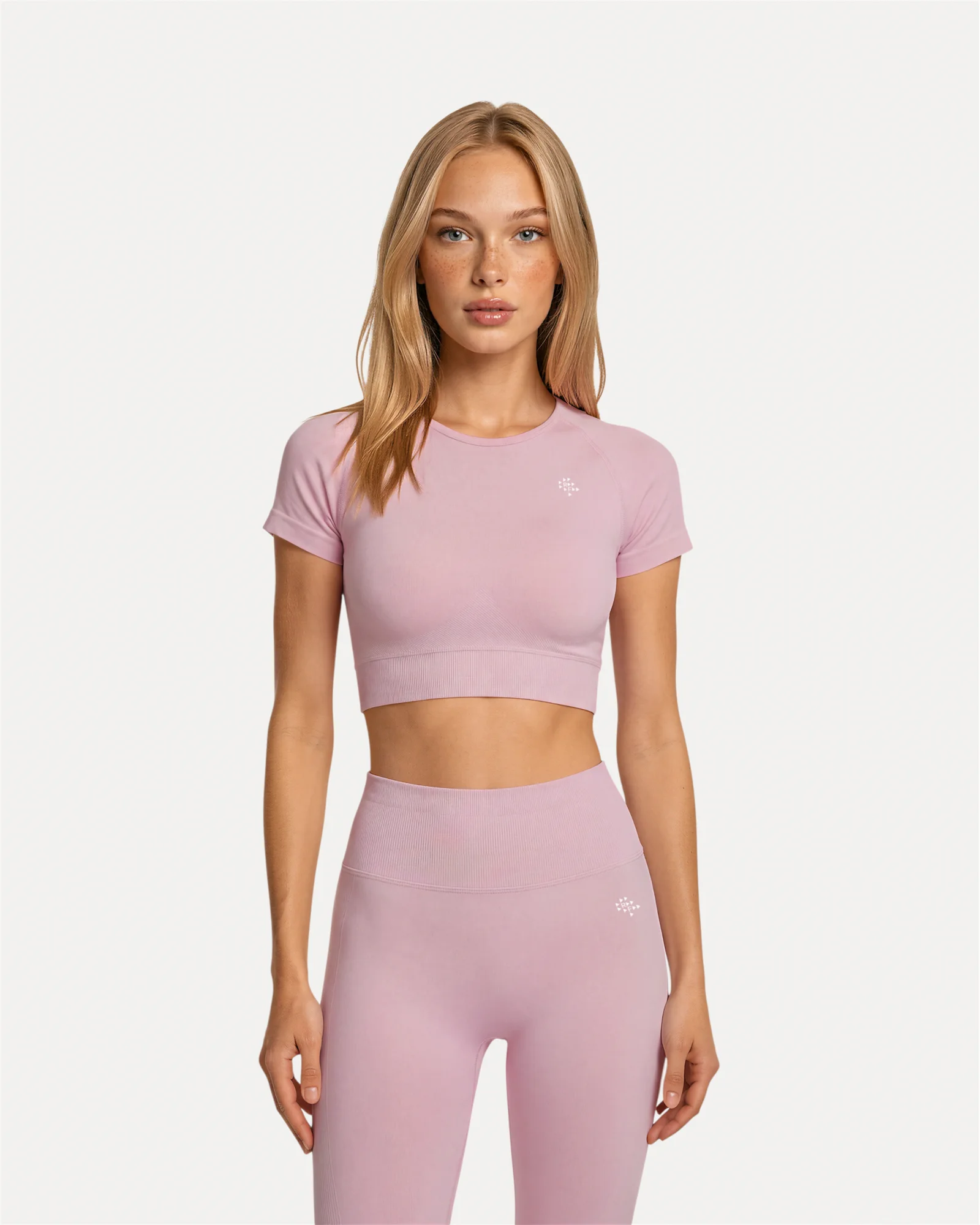 Front view of soft pink Realfit Core short-sleeve crop top for women