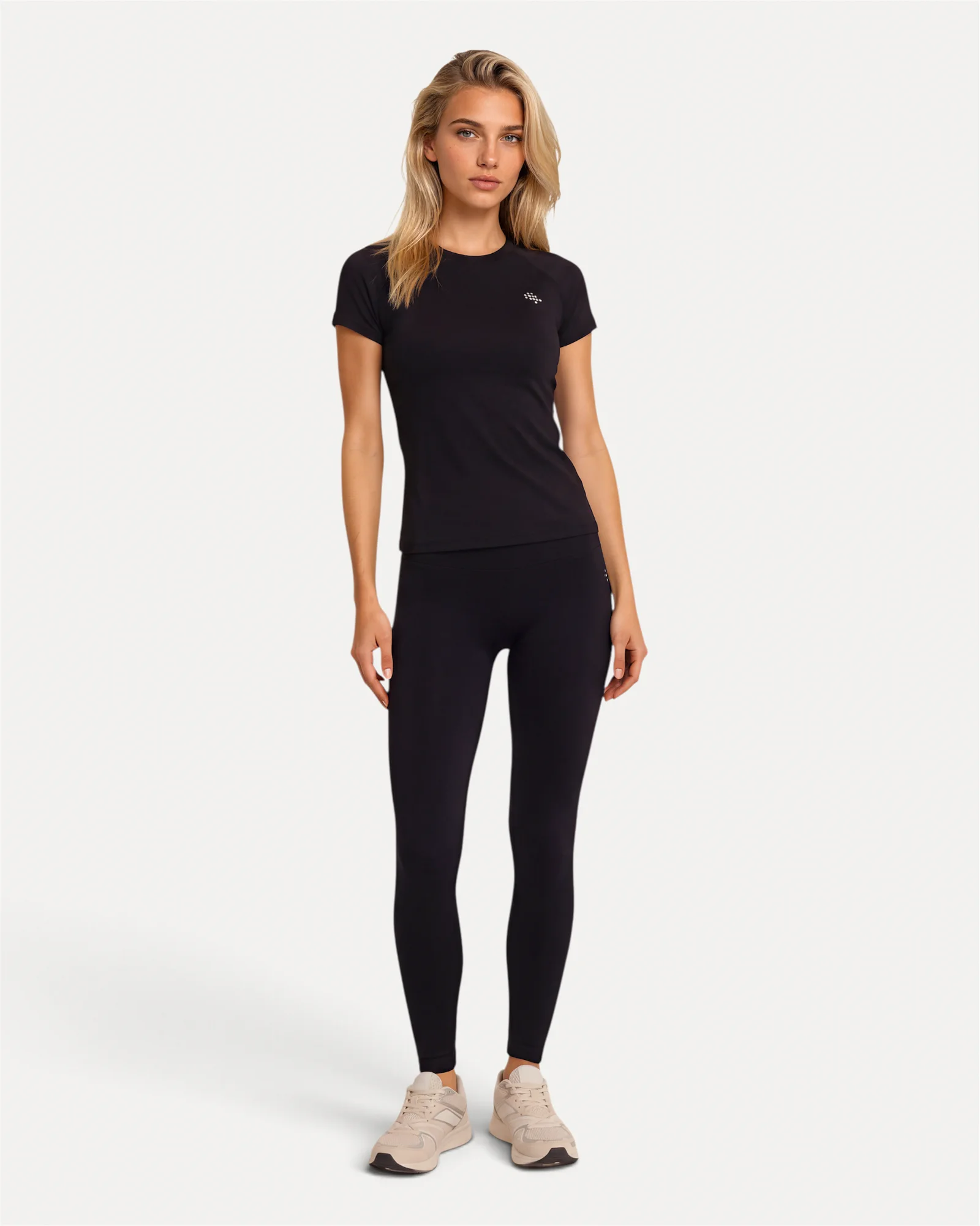 Front lifestyle view of black Realfit short-sleeve top for women