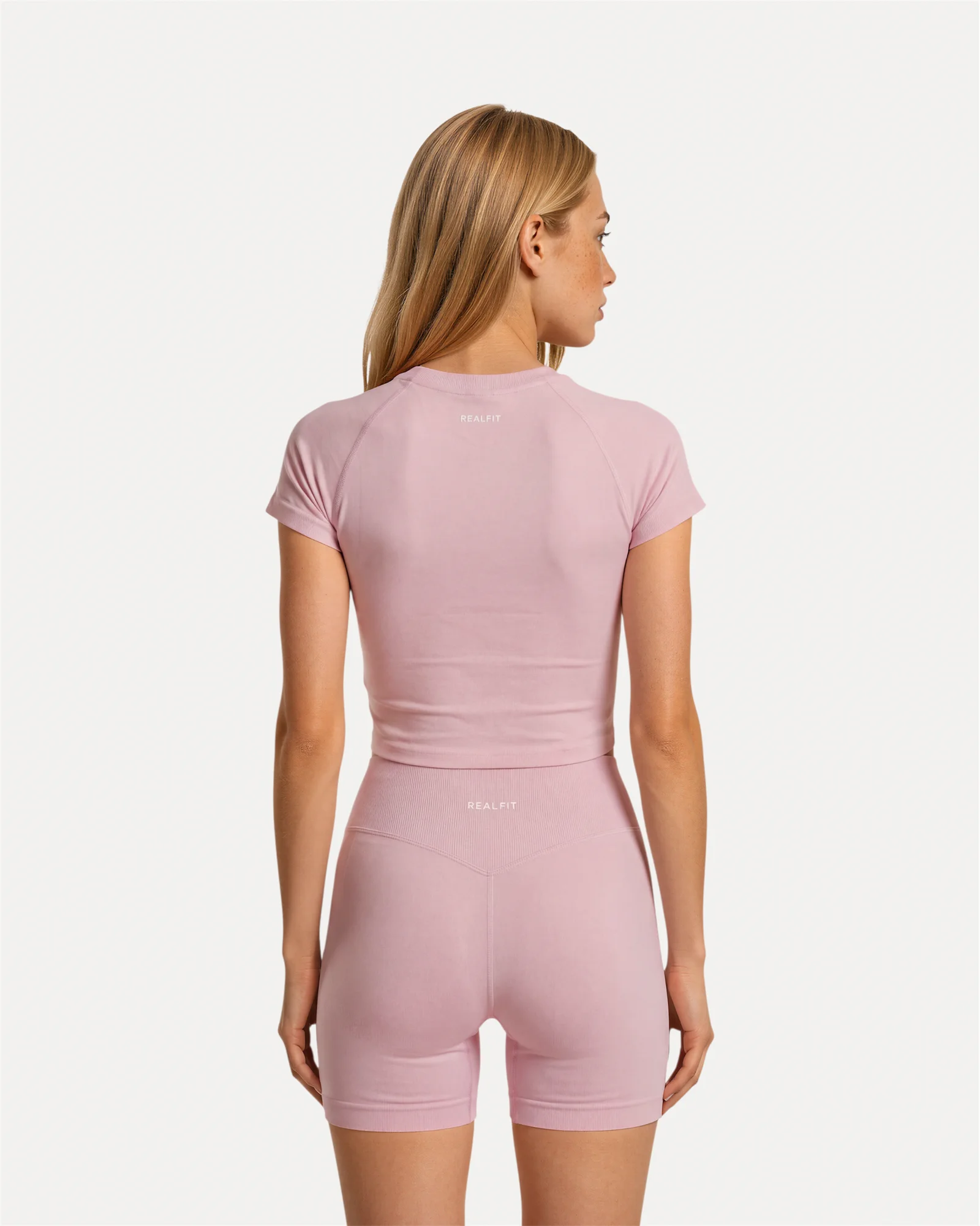 Back view of soft pink Realfit Core short-sleeve top for women